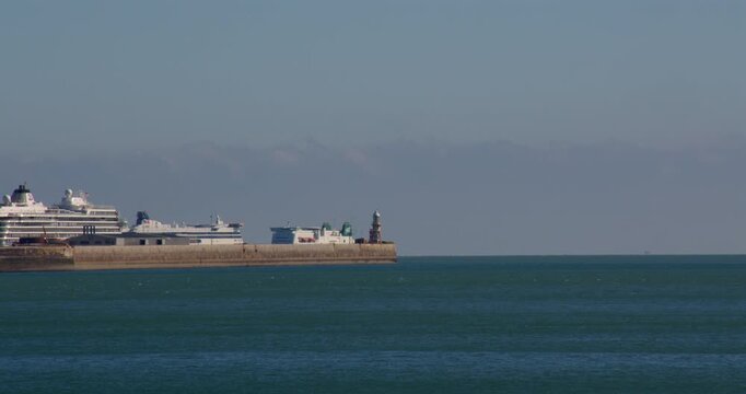 wide shot of an English channel roll on roll off ferry leaving the port of dover