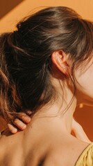 Obraz premium Close up of ear and neck in natural light for skincare and beauty concepts