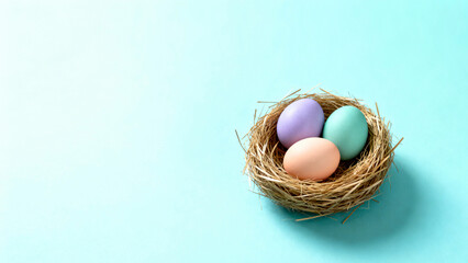Obraz premium Three Pastel Easter Eggs in Straw Nest on Turquoise Background with Copy Space