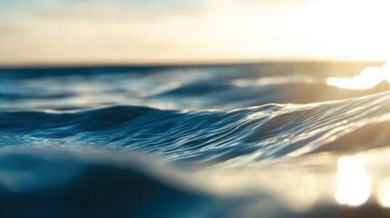 Sunlight shining on the smooth surface of the ocean during a calm afternoon at the beach with gentle waves