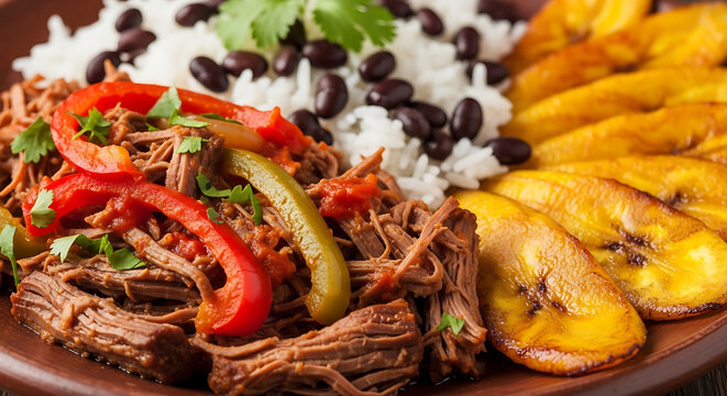 Traditional Cuban Ropa Vieja with Shredded Beef, Black Beans, White Rice and Fried Plantains