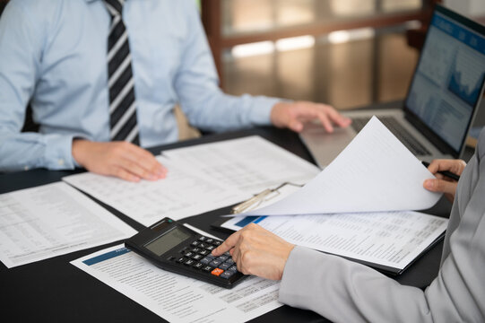 Professional financial advisor discussing personal investment strategy with partnership in a modern office, wealth management and retirement planning concept.