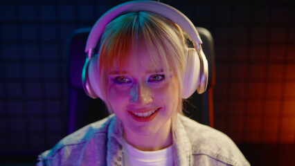 Young teen streamer gamer woman play online video game computer. Esport concept gaming virtual entertainment. E sport win videogame tournament live stream. Happy female player cool girl competition. © Татьяна Епанешникова