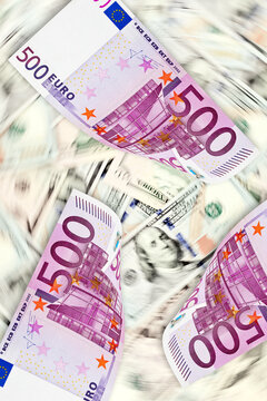 Five hundred-euro banknotes on the background of American dollar bills in blurred motion