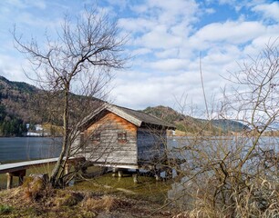 From  Fischhausen on the southern shore of Schliersee lac, magnificent little wooden chalets on pontoons and boathouses with swimming area with fantastic scenery facing  bavarian Alps