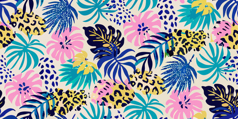 Vibrant tropical leaf and animal print seamless pattern on a light background © Ganesh