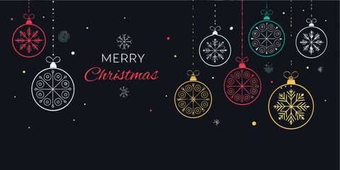 Festive christmas ornaments and a merry christmas greeting on black © Dibyendu