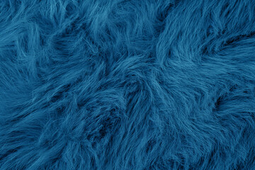 Obraz premium Abstract background of textured deep blue plush soft shaggy faux fur material fabric detail