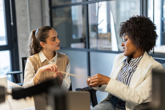 Colleagues collaborating and communicating together in modern office