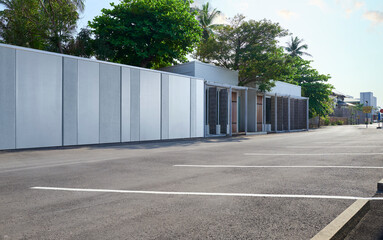 Modern building facade next to empty parking lot © jamesteoh.art