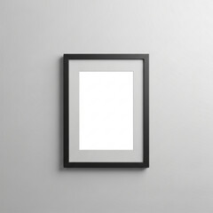 A minimalist black picture frame with a white mat, hanging centered on a plain light grey wall, ready for a cherished photograph or artwork.
