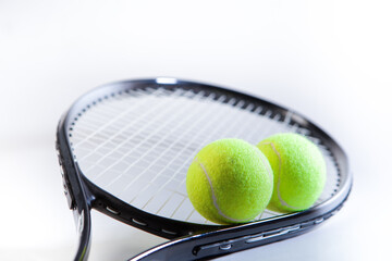 Tennis racket and balls on a white background. Sport equipment.