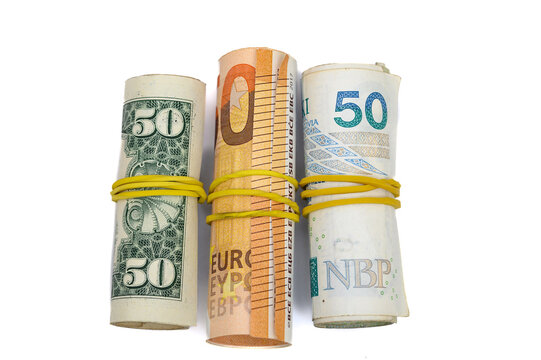 Rolled money on white background, foreign currencies, currency exchange, isolated banknotes of world currencies