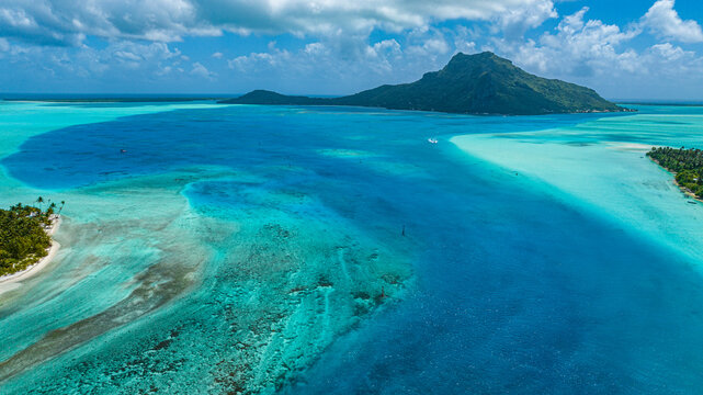 Aerial view of lagoon and island Maupiti in Society Islands French Polynesia