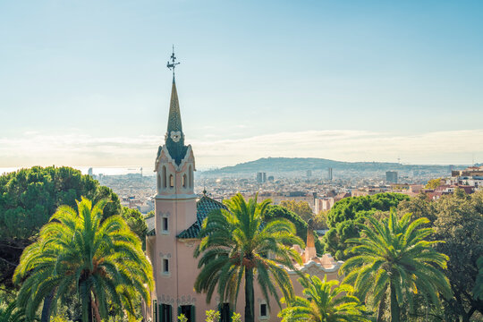 View of Parc Guell landmark architecture in Barcelona with palm trees