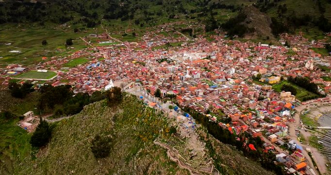 Cerro Calvario viewpoint overlooking the town of Copacabana on the shore of Lake Titicaca, Bolivia. Aerial drone