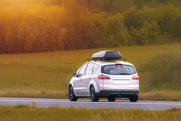 Automotive SUV with Roof Box on Countryside Journey