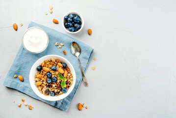 Baked granola with yogurt and blueberries.