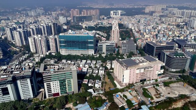 Aerial footage of a developed city in India. Hyderabad as the City of Destiny for IT and Pharmaceutical companies skyscrapers of Telangana. Cityscape of HITEC City is spread across City.