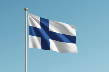 Obraz premium Finland national flag waving on pole against clear blue sky background.