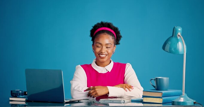 Happy, laptop and face of businesswoman in studio with research for creative project with books. Smile, computer and portrait of female magazine editor with pride for publishing by blue background.
