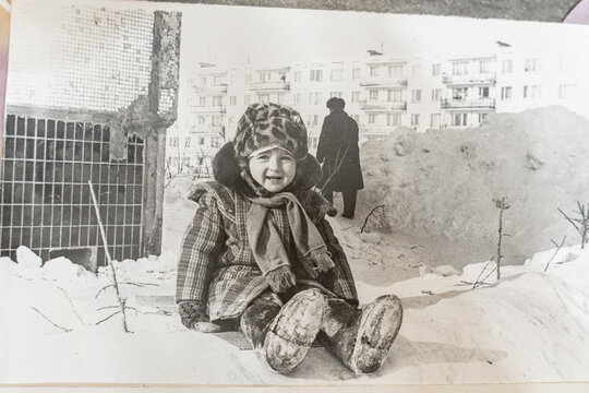 Soviet girl a small child. Old vintage sepia photograph taken in the USSR in the 1983