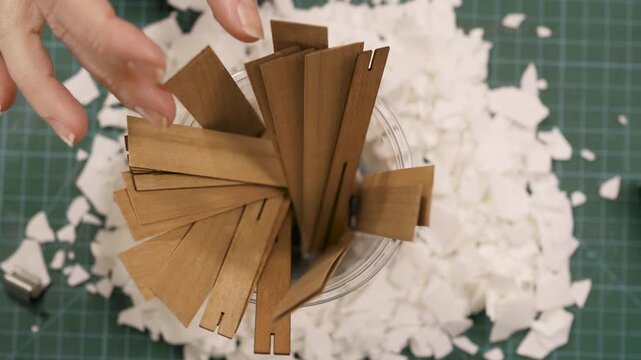 Wooden wicks and soy wax flakes. Top view of Homemade candle materials. concept of making handmade candles
