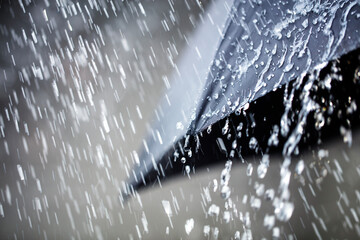Rain on umbrella background, weather forecast and environment concept © Brian Jackson