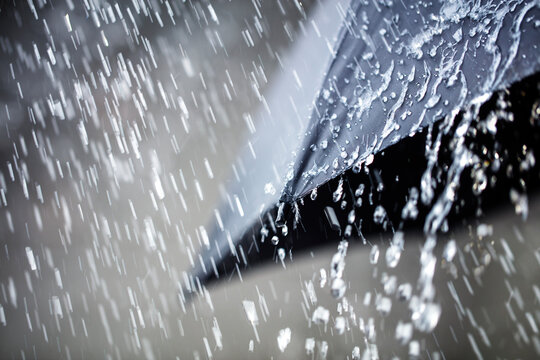 Rain on umbrella background, weather forecast and environment concept