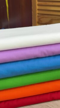stack of colorful fabrics