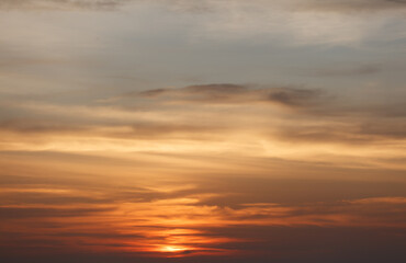 The sky is orange and cloudy