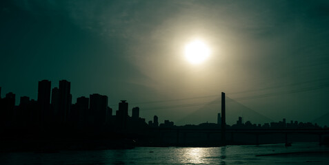 The silhouettes of city skyline  under the sunlight during the sunset in Chongqing, China