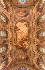 Naklejka premium BUSTO ARSIZIO, ITALY - JANUARY 19, 2026: The ceiling fresco of St. Michael in the battle with the Fallen angels in church Chiesa di San Michaele by Ettore and Mario Chiodo Grandi (1932 - 1934).