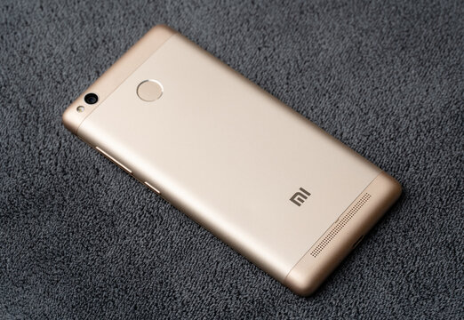 Dnipro, Ukraine 03.11.2025: Xiaomi Redmi 3S. A classic smartphone with a touchscreen and physical home button. Ideal for app mockups, mobile tech concepts, and vintage electronic themes.	