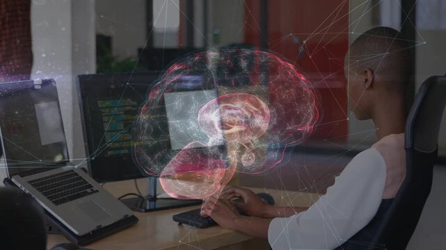 Seated woman typing while monitor code launching AR brain rotating revealing tech layers over hands