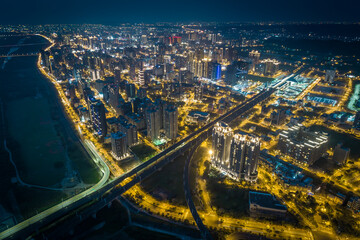 Fototapeta premium Zhubei City Skyline at Night - Asia modern business concept image, panoramic cityscape birds eye view use the drone, shot in Hsinchu, Taiwan.
