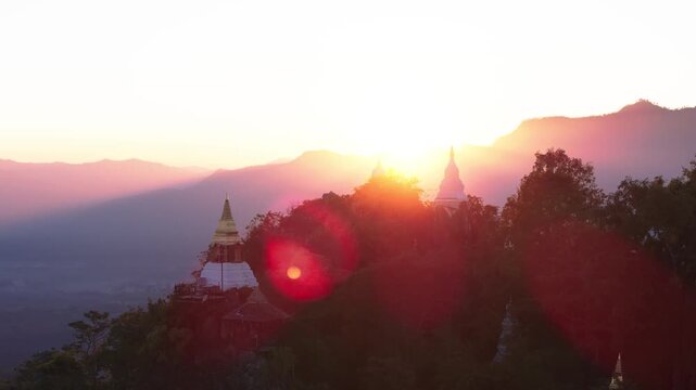 Cinematic sunset view of mountain Buddhist temple on mountain top