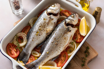 Baked fish with vegetables and lemon