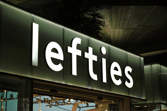 Lefties fashion brand glowing sign on glass facade