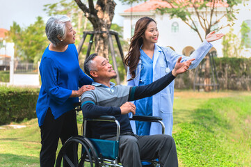 man in a wheelchair is being assisted by a nurse and a woman