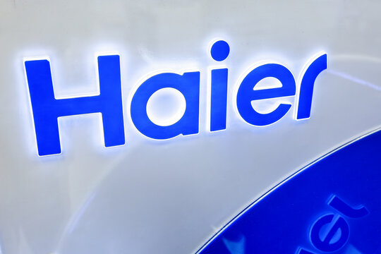 Haier company brand glowing logo. Chinese multinational home appliances and consumer electronics company