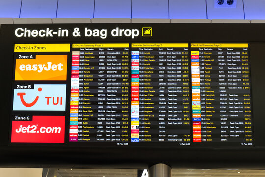 Manchester, UK Feb 16 2026 - Check-in and bag drop sign at Manchester airport departures terminal showing the flight destinations and desks where passengers can check their luggage in.