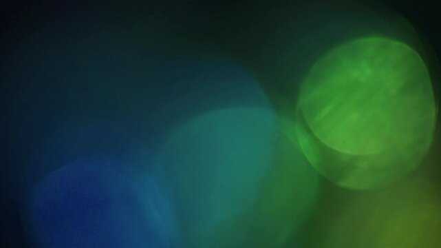 light leak and bokeh overlay with blue and green tones, ideal for adding atmospheric effects to video projects. This visual element enhances mood and transitions.