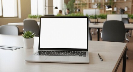 Fototapeta premium Modern Laptop Displaying Blank Screen on Light Wood Desk in Contemporary Open Office with Natural Light and Greenery Accent