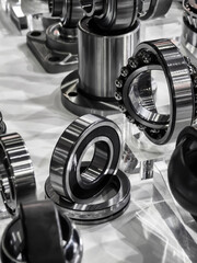 Collection of metal ball bearings and industrial components on display at a manufacturing expo