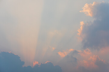 Sunset Sunbeams Behind Large Cumulus Cloud