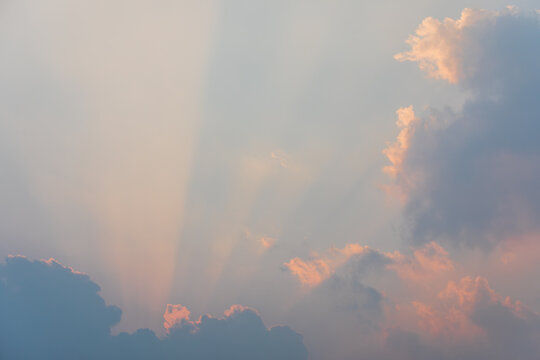 Sunset Sunbeams Behind Large Cumulus Cloud