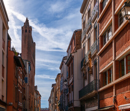 Rue du Taur, and the bell tower wall of the Church of Taur, in Toulouse, Haute Garonne, Occitanie, France.