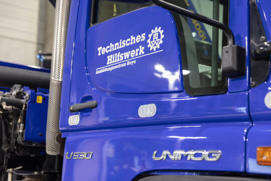 BERLIN, GERMANY, January 16th 2026: Photo of Blue Unimog Truck Door With Technical Relief Organization Logo At Internationale Gr&uuml;ne Woche Trade Fair In Berlin Germany