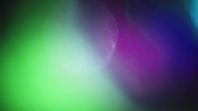 Light leak and bokeh overlay with vibrant green, purple, and blue hues, perfect for adding a dreamy or energetic feel to your projects. This visual element is ideal for transitions and mood setting.